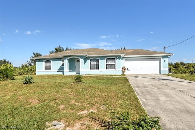 single story home with a front lawn and a garage