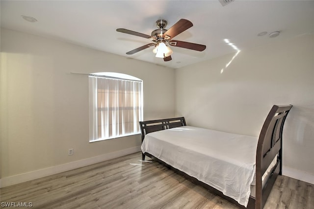 bedroom featuring ceiling fan and light wood-type flooring