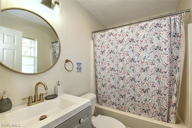 full bathroom featuring toilet, shower / tub combo with curtain, and vanity