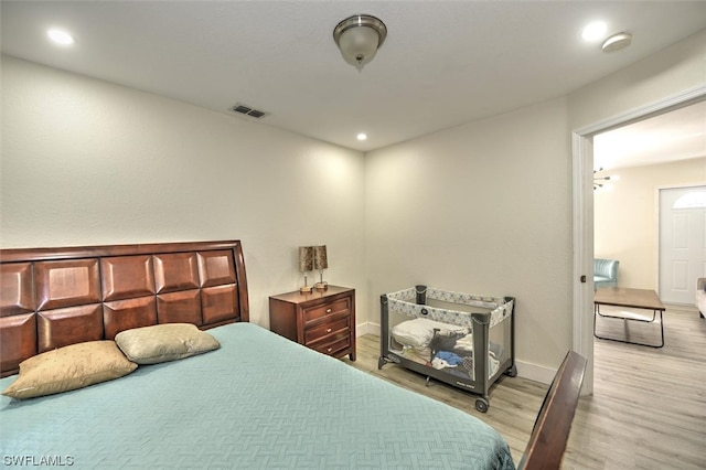 bedroom featuring light hardwood / wood-style floors