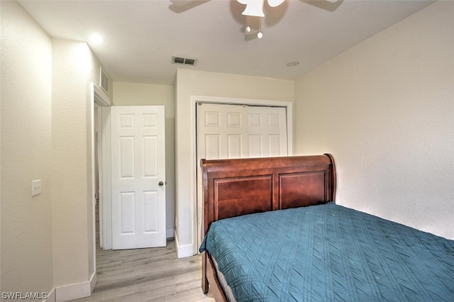 bedroom featuring a closet, ceiling fan, and light hardwood / wood-style flooring