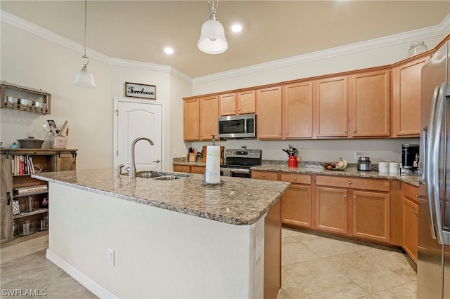 kitchen featuring decorative light fixtures, sink, stainless steel appliances, a center island with sink, and light stone counters