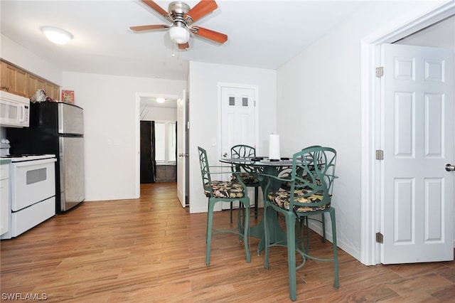 2147 Washington Ave, Naples, FL 34112 - dining area with light hardwood / wood-style floors and ceiling fan