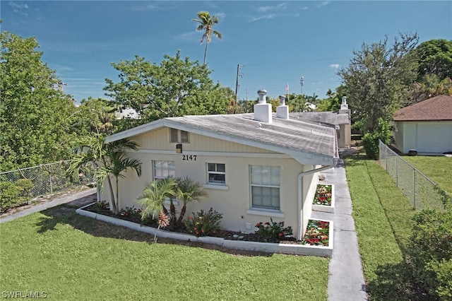 2147 Washington Ave, Naples, FL 34112 - view of front of home with a front yard