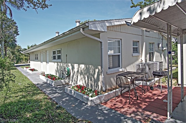 2147 Washington Ave, Naples, FL 34112 - view of home's exterior with a wooden deck