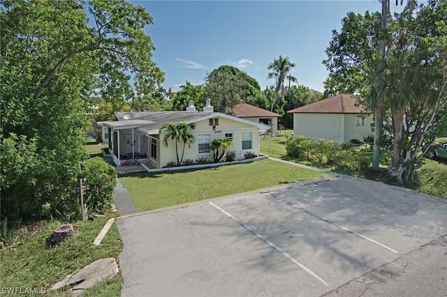 2147 Washington Ave, Naples, FL 34112 - back of property featuring a yard