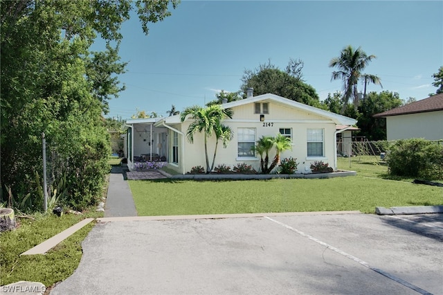 2147 Washington Ave, Naples, FL 34112 - view of front of property with a front lawn