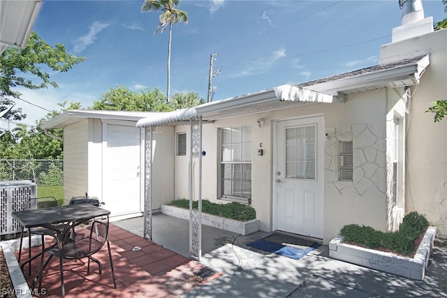 2147 Washington Ave, Naples, FL 34112 - entrance to property featuring central air condition unit