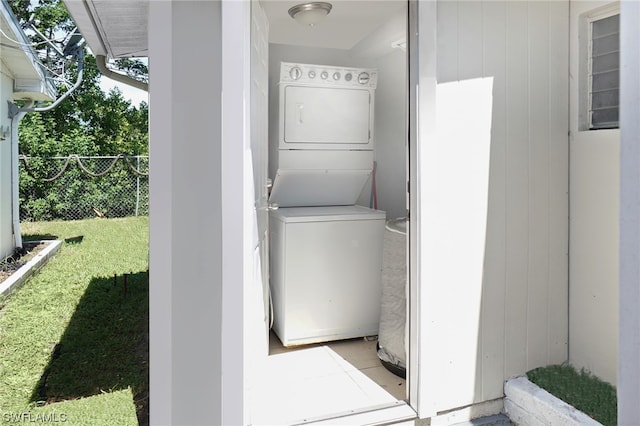 2147 Washington Ave, Naples, FL 34112 - laundry room featuring stacked washer and dryer