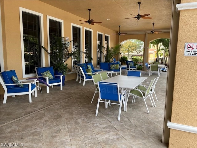 view of terrace featuring ceiling fan