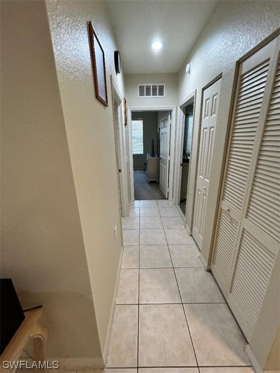 hallway with light tile flooring