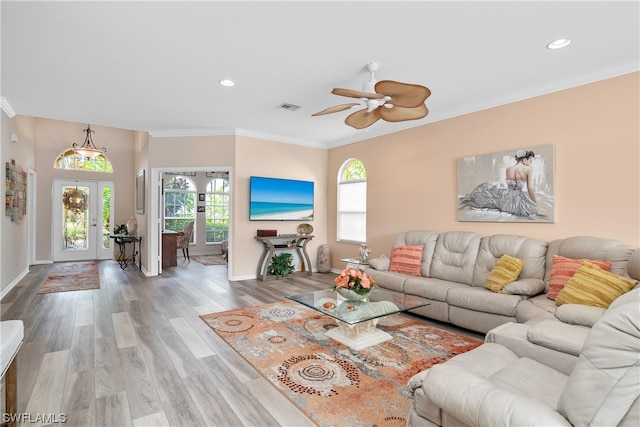 living room with ceiling fan, french doors, hardwood / wood-style floors, and ornamental molding