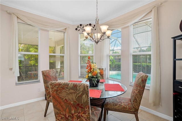 dining space featuring a notable chandelier, ornamental molding, and light tile flooring