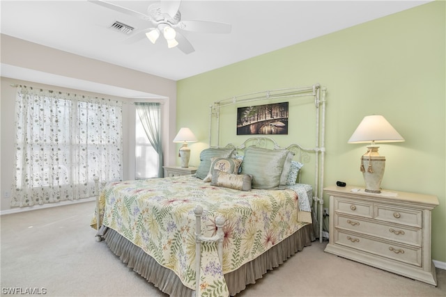 bedroom with light carpet and ceiling fan