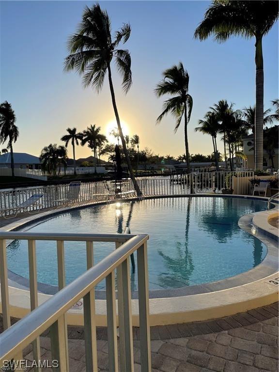 view of pool at dusk