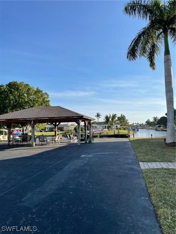 view of home's community featuring a water view and a gazebo