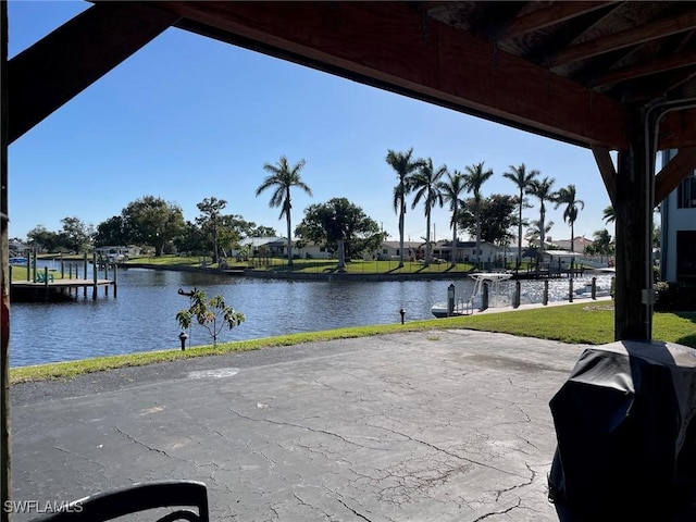 view of patio / terrace featuring a water view and area for grilling