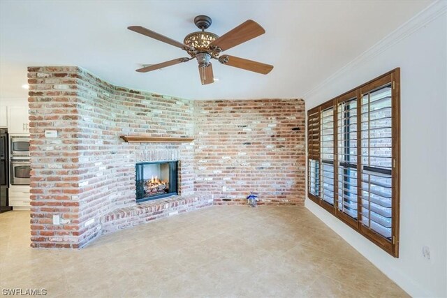 unfurnished living room with brick wall, ceiling fan, light tile flooring, and a fireplace