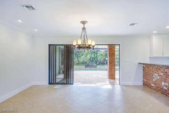 unfurnished dining area featuring crown molding, light tile floors, and an inviting chandelier