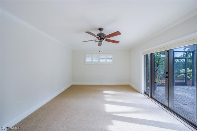 unfurnished room featuring plenty of natural light, ceiling fan, french doors, and carpet flooring