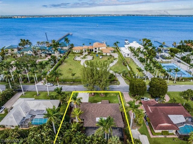 birds eye view of property featuring a water view