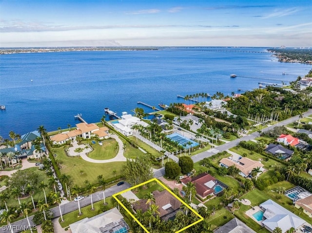 birds eye view of property featuring a water view