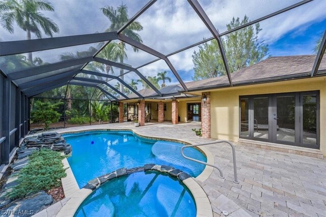 view of pool featuring a lanai and a patio