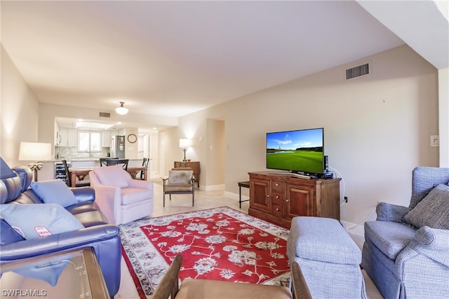 living room with light tile floors