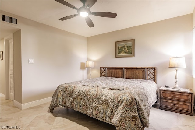 bedroom featuring light tile flooring and ceiling fan