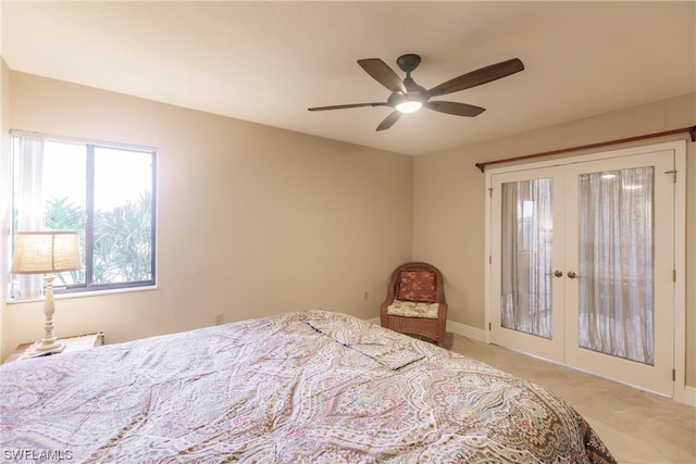 bedroom featuring light tile flooring, ceiling fan, and french doors