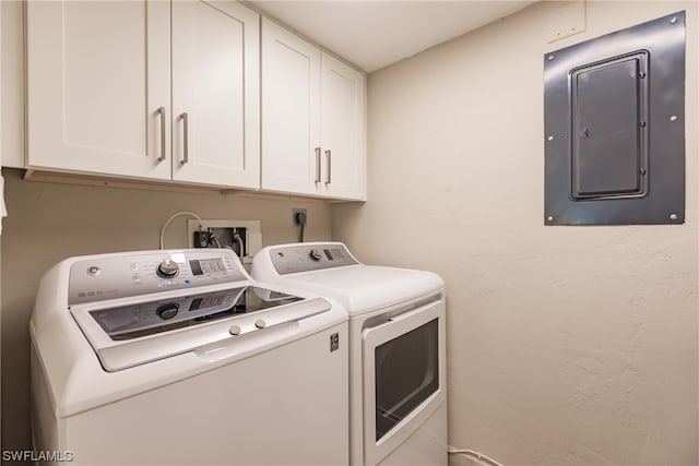 laundry area with washer hookup, cabinets, electric dryer hookup, and washing machine and clothes dryer