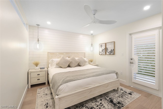 bedroom with access to exterior, ceiling fan, and light wood-type flooring