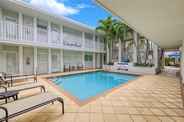 view of pool featuring a patio