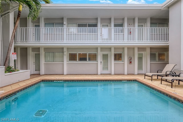 view of swimming pool with a patio area