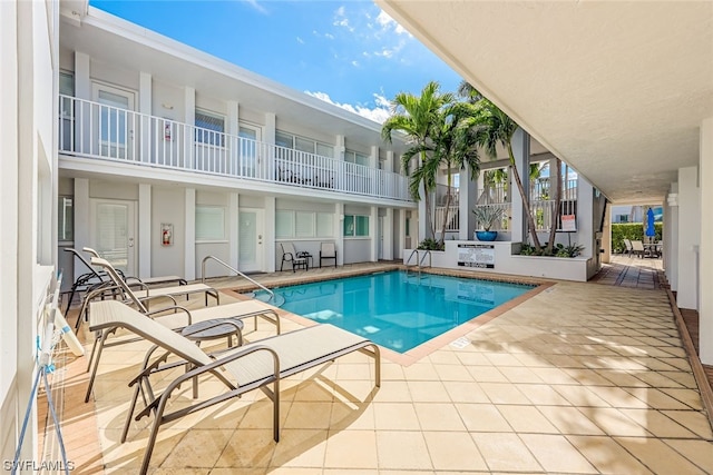 view of swimming pool with a patio