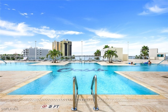 view of swimming pool featuring a patio area