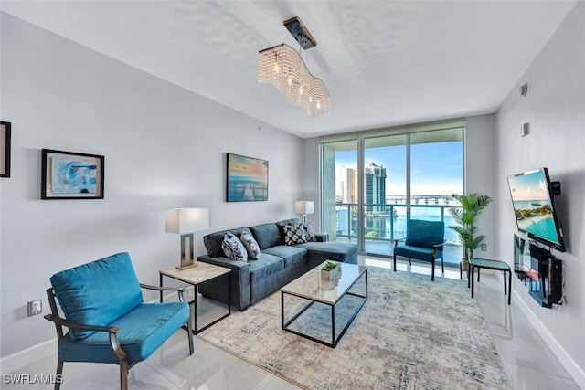 living room featuring expansive windows and an inviting chandelier