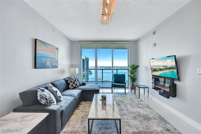 tiled living room featuring floor to ceiling windows