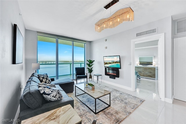 living room featuring expansive windows and an inviting chandelier