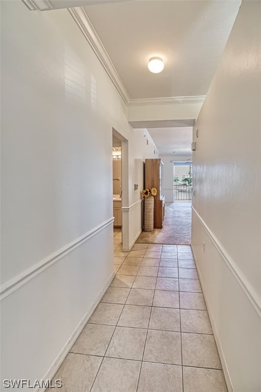 hall featuring crown molding and light carpet