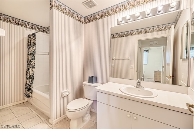 full bathroom with tile floors, toilet, oversized vanity, and shower / tub combo