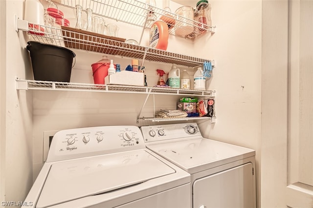 laundry room featuring separate washer and dryer