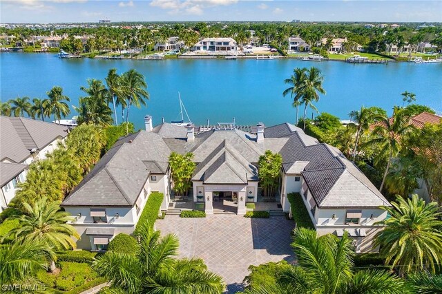 birds eye view of property with a water view