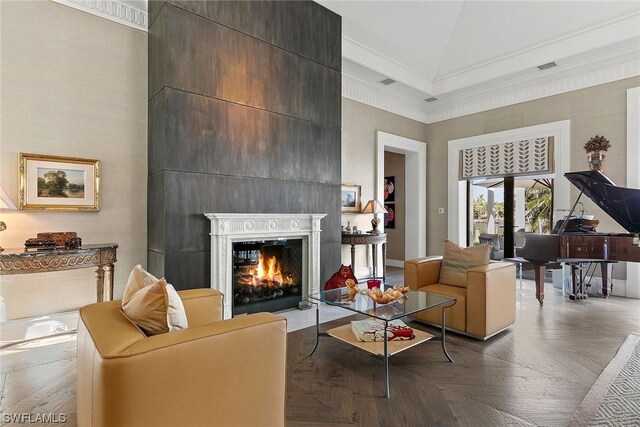 living room featuring ornamental molding and high vaulted ceiling