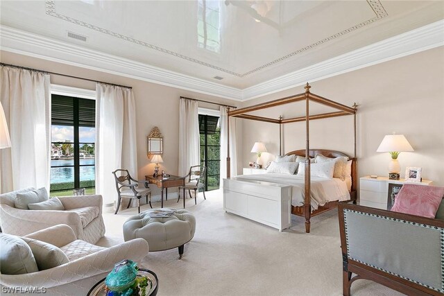 carpeted bedroom with a water view, crown molding, and access to outside