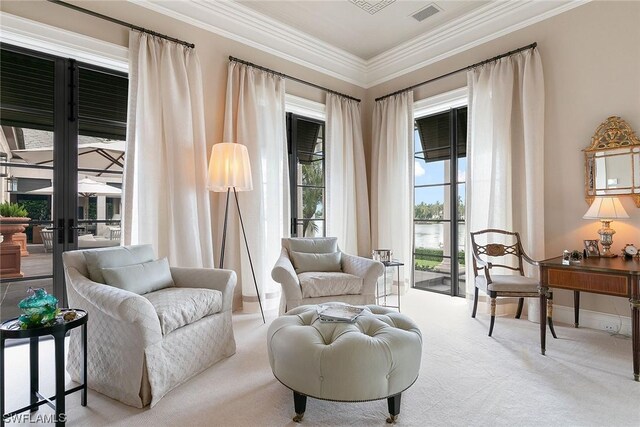 living area with light carpet and crown molding