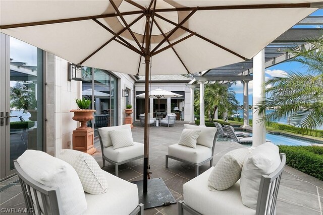 view of patio / terrace featuring a pergola and an outdoor hangout area