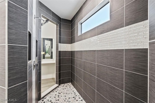 bathroom with a tile shower