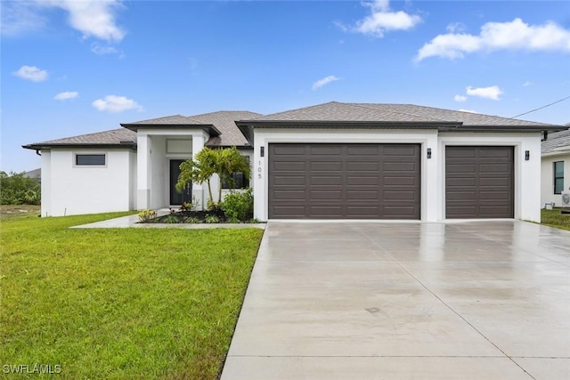 view of front facade featuring a garage and a front yard