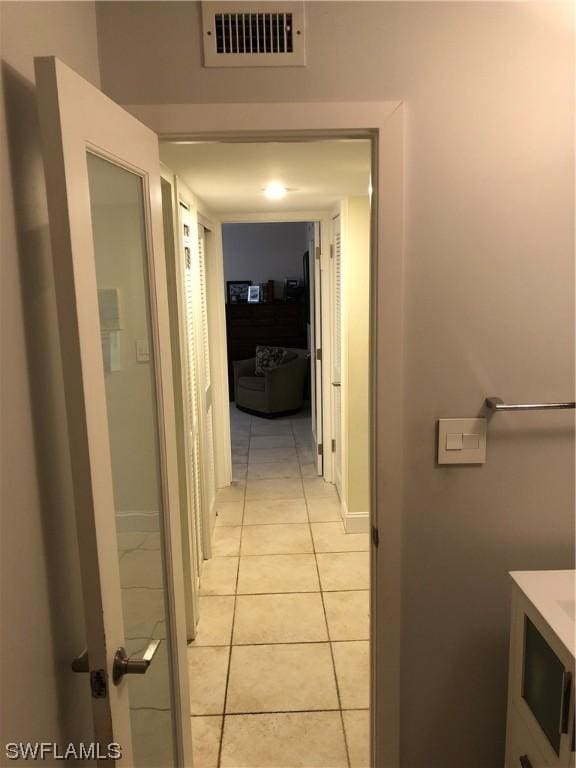 bathroom featuring tile patterned flooring and vanity